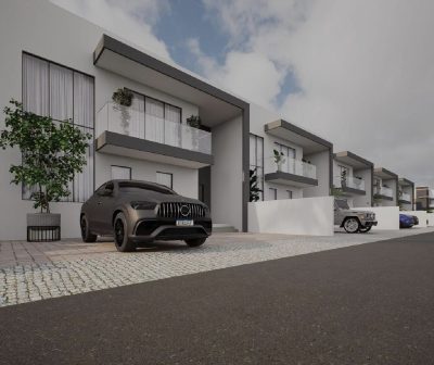 Row of residences with cobblestone forecourt driveway